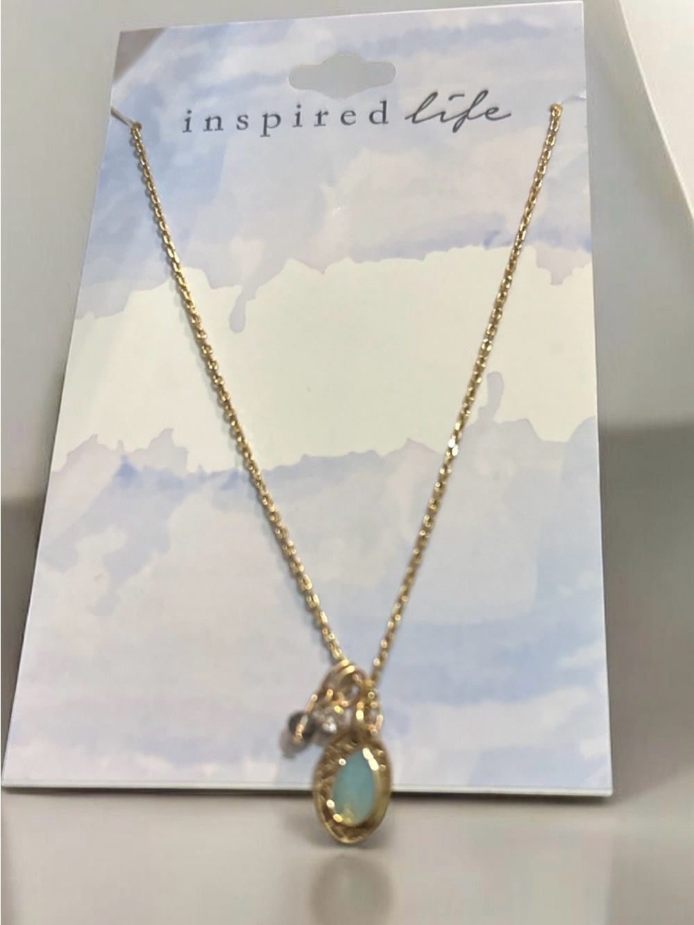 Inspired Life Gold Necklace with Light Blue Pendant
1943